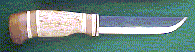 Click here for an enlarged image of the knife
and it's sheath.