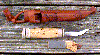 Click here for an enlarged image of the knife
and it's sheath.