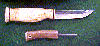 Click here for an enlarged image of the knife
and it's sheath.