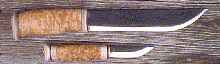 Click here for an enlarged image of the knife
and it's sheath.