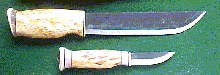 Click here for an enlarged image of the knife
and it's sheath.